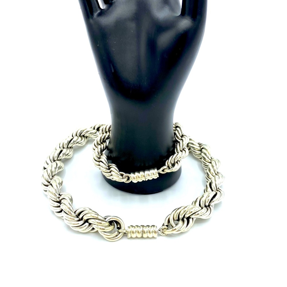 Silver bracelet & necklace. It is heavy & showy!